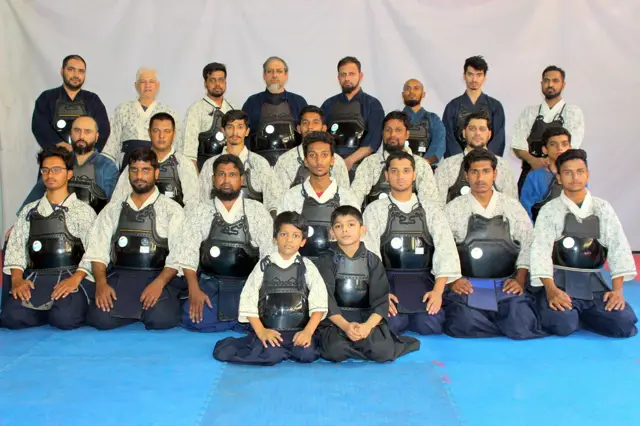 Students of every age, from children to seniors, in armour